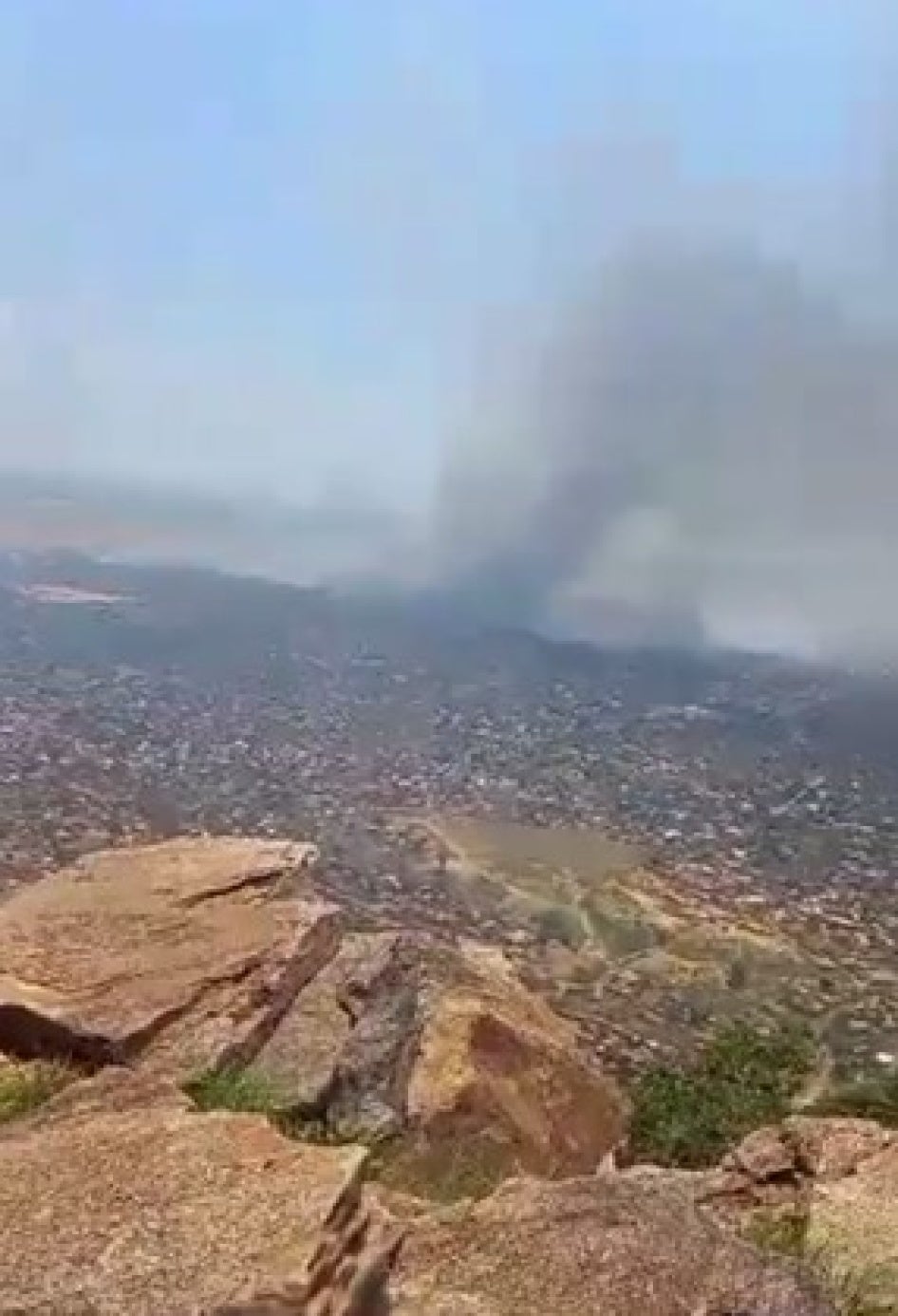 View of fires burning in a town