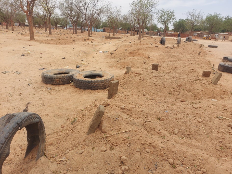 Tires marking dirt graves 