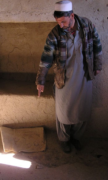 An education official points to the spot where an explosive device was left at the front of the class of a girls’ school in Wardak province in late 2005. The mine was defused but the school building was abandoned. “Of course I’m anxious, for my own daughters—it’s not fear, it’s frustration. How long will this last? What do these people want?” he told Human Rights Watch. © 2005 Human Rights Watch/Saman Zia-Zarifi.