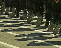 Iraqi police officers march during a graduation ceremony in Jordan, Sept. 16, 2004 (Photo: Ali Jareki/Reuters).