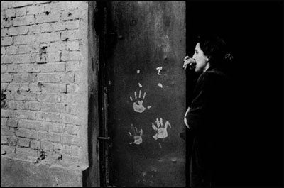 A Chechen woman who fled fighting in Grozny now lives as a refugee in Georgia. Her son was wounded during bombing attacks. &copy; 2002 Stanley Greene / NOOR