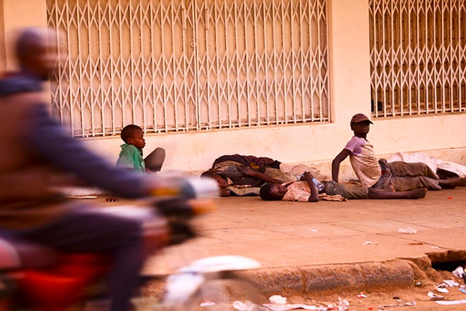 <p>Street children in Mbale town, east of Kampala sleep on shop verandas after owners have closed for the day.</p>