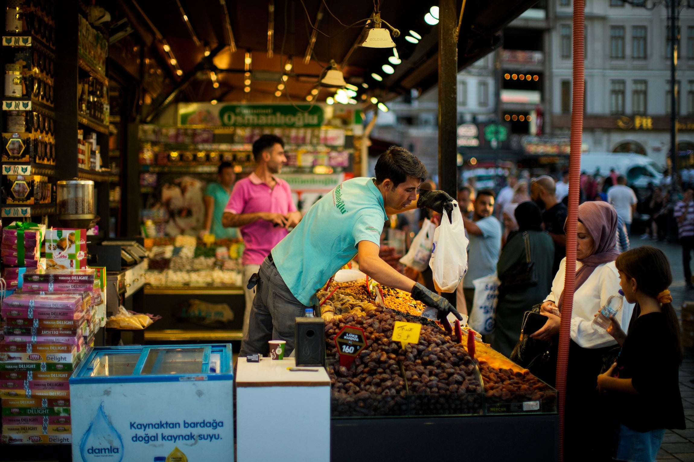 A clerk talks to a customer at the Egyptian spices market in Istanbul.