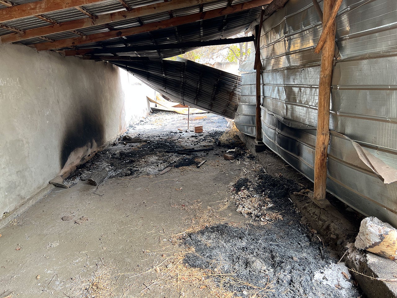 Fire damage inside a commercial building in the Kyrgyz village of Dostuk (Batken district). The village was completely destroyed by fire  while briefly under the control of Tajik forces on September 16, 2022.