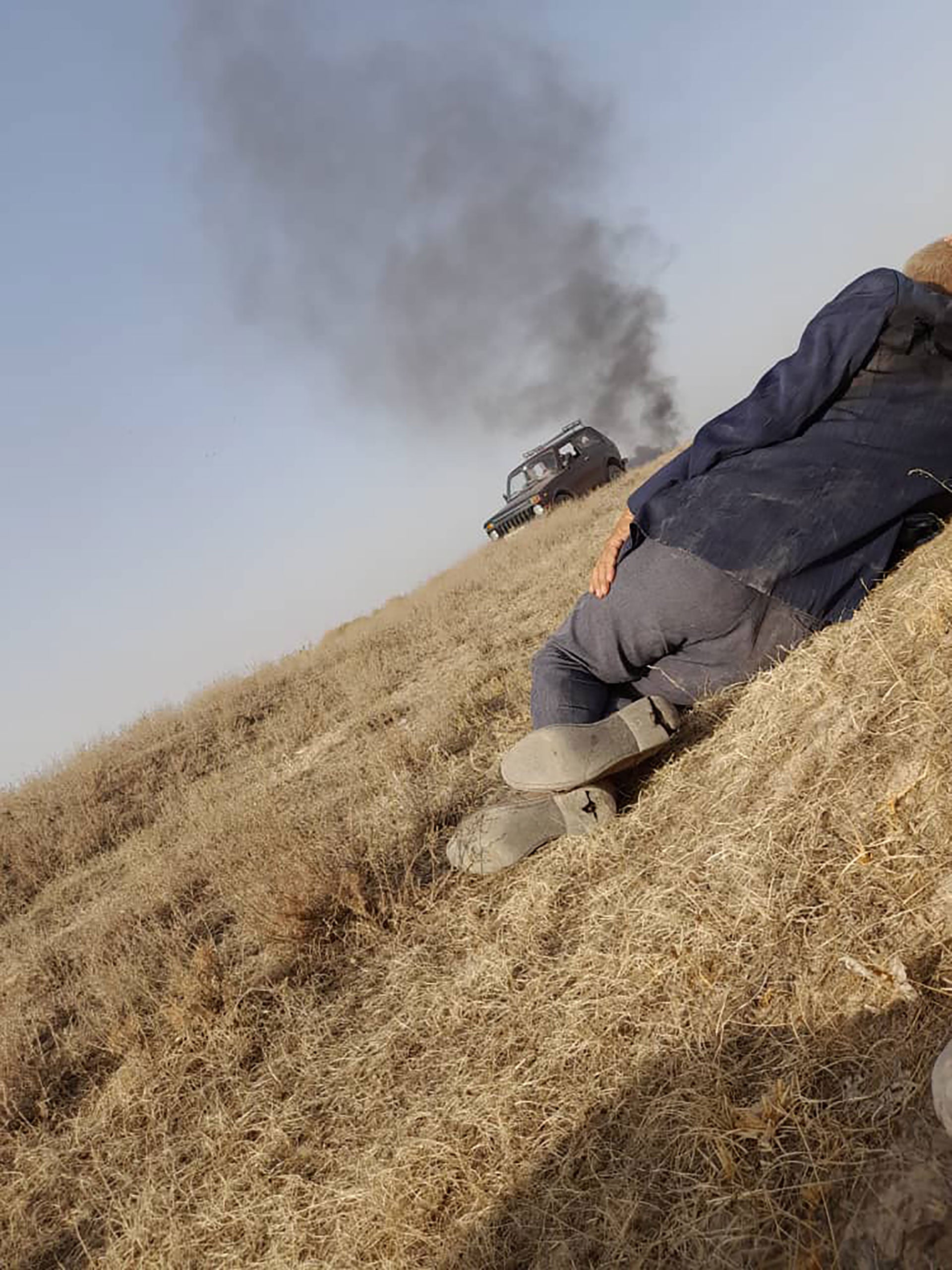 A photo taken by a member of the Kyrgyz Sulaimanov family, as they hid by the roadside when Tajik forces attacked their vehicle near the Kyrgyz village of Maksat, on September 16, 2022.