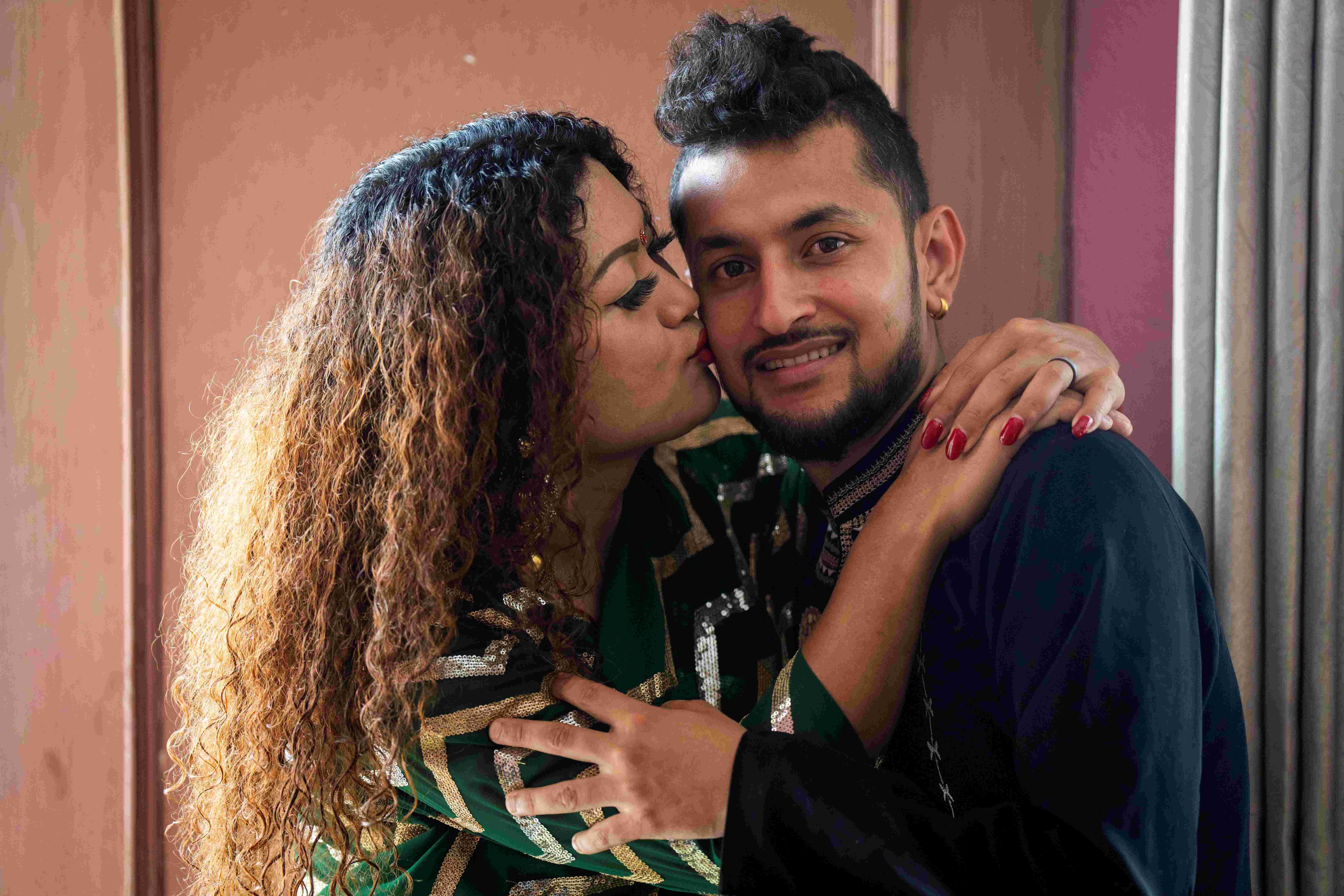 Surendra Pandey, right, and Maya Gurung, who married six years ago, pose for a photograph 