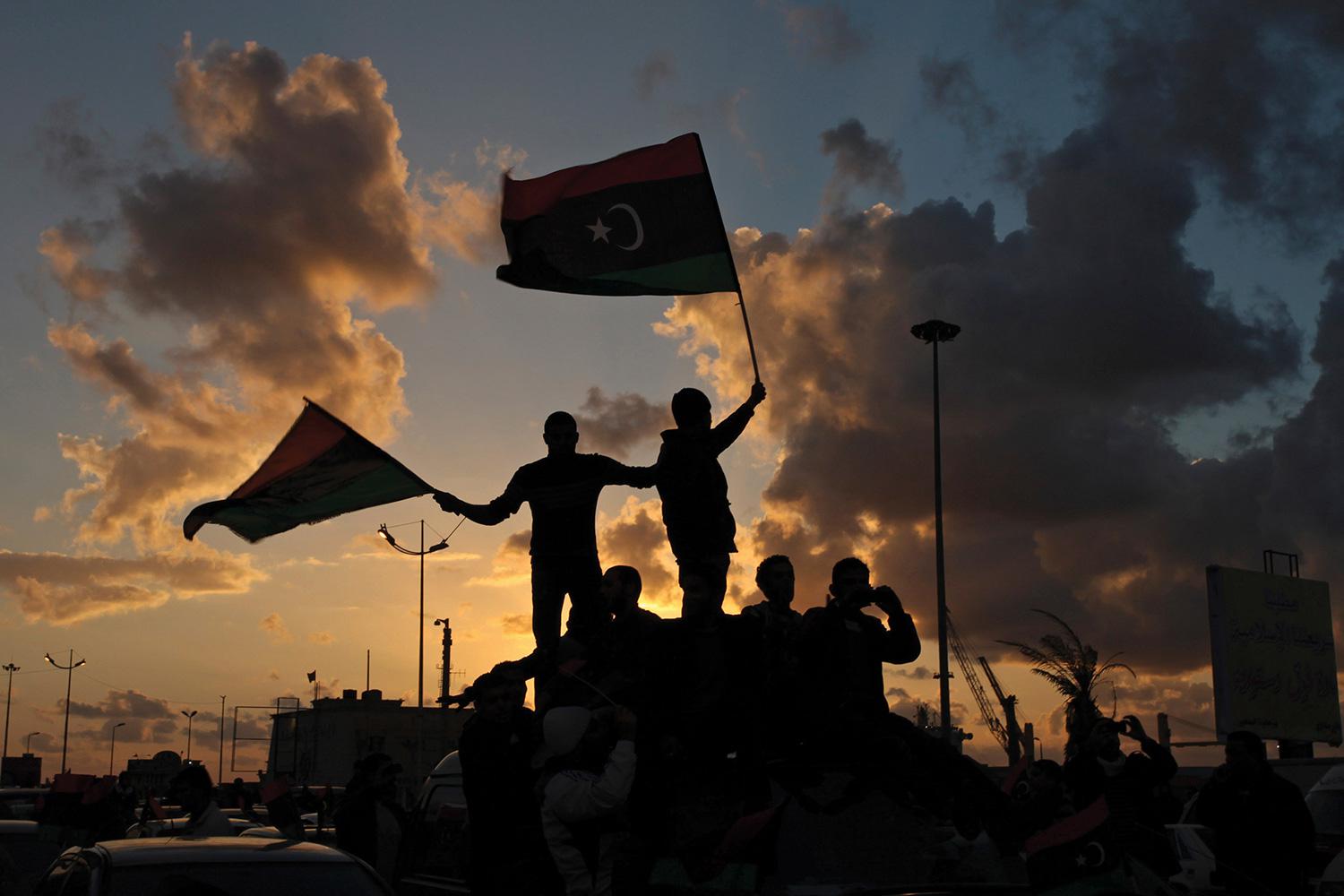 In Benghazi, Libya, on February 15, 2013 Libyans wave their national flags during a celebration to commemorate the second anniversary of the revolution that ousted Muammar Gaddafi. 