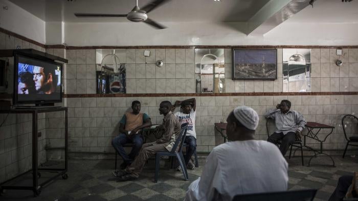 Men sitting in a cafe predominantly visited by Sudanese migrants in Cairo, Egypt, 08 August 2017.