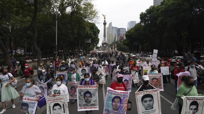 Families and friends march in Mexico City seeking justice for the missing 43 Ayotzinapa students on the eighth anniversary of their disappearance.