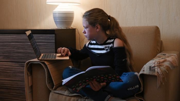 A child studies online from home in Moscow, Russia, amidst school closures during the Covid-19 pandemic.