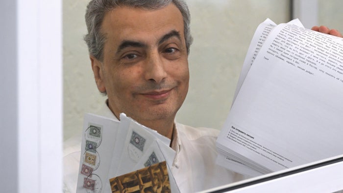 Lev Shlosberg, deputy leader of the Yabloko party, stands in the defendant's box