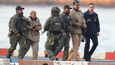 President of Venezuela Nicolás Maduro and his wife, Cilia Flores, are in handcuffs after landing at a Manhattan helipad, escorted by US Federal agents en route to a Federal courthouse in Manhattan on January 5, 2026, in New York City.