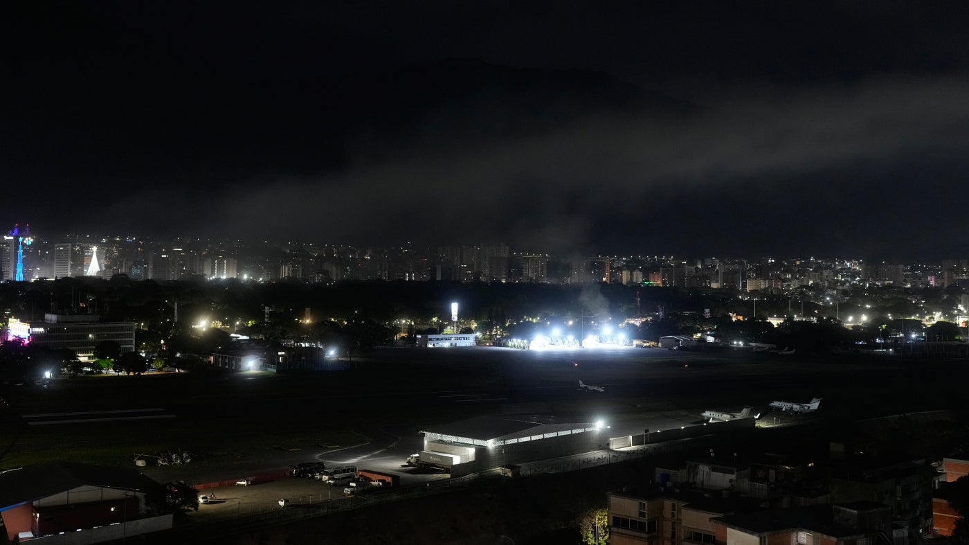 Smoke rises over an airport in Caracas, Venezuela