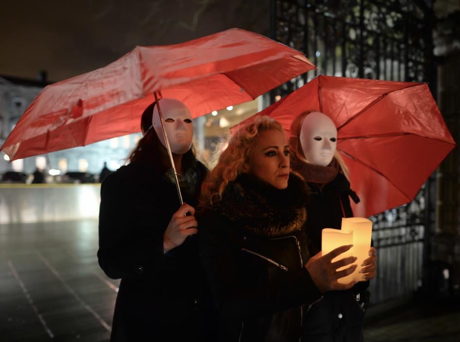 Kate McGrew and other members of Sex Workers Alliance Ireland hold a candlelit vigil outside Leinster House in Dublin, Ireland to mark International Day to End Violence against Sex Workers, December 17, 2014.