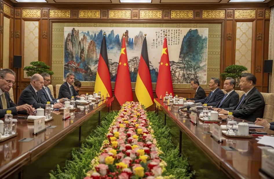 German Chancellor Olaf Scholz sits opposite of Chinese President Xi Jinping during talks at the State Guest House in Beijing, China, April 16, 2024.