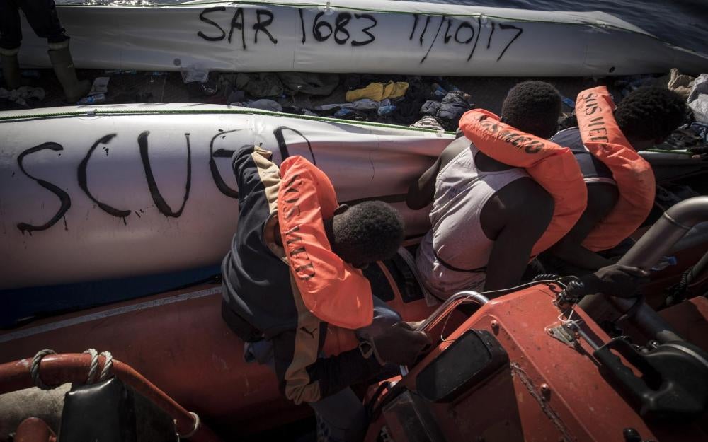 SOS MEDITERRANEE crew mark the rubber dinghy with the search-and-rescue (SAR) case number and date. 