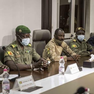 Leaders of the National Committee for the Salvation of the People, including its leader Col. Assimi Goita, center, and spokesman Ismael Wague, left, and group member Malick Diaw, center-left, with a ECOWAS delegation, Aug. 22, 2020. © 2020 AP 