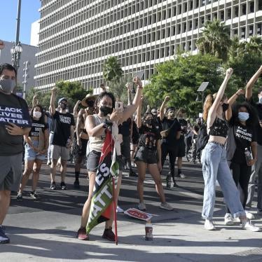 Demonstrators raise their fists during a City Hall rally organized by No More Names LA , Saturday, August 29 in Los Angeles to protest the shooting of Jacob Blake in Kenosha, Wisconsin.