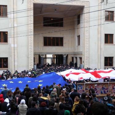 People take part in a protest against the controversial "foreign agents" bill outside the parliament building in Tbilisi, Georgia March 6, 2023.