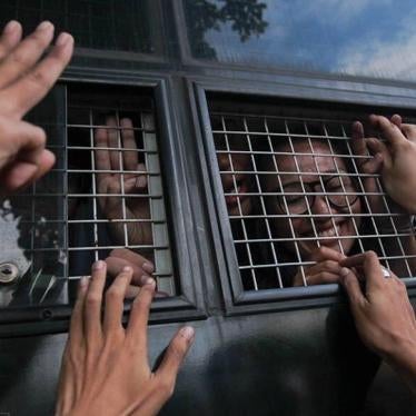 Student activists are taken from the Bangkok military court to prison after being arrested and charged for holding anti-coup protests on June 26, 2015.