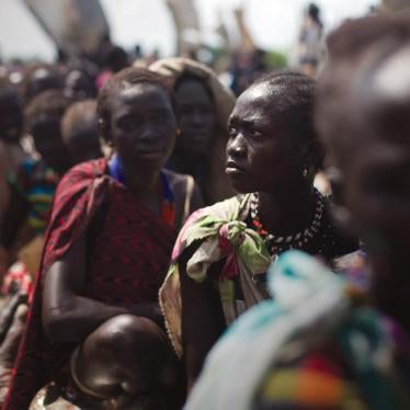 Women from the Murle tribe wait to receive emergency food aid in Pibor town. 