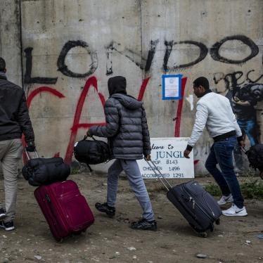 Young men depart the Calais migrant camp, 24 October 2016.