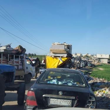 Internally displaced Syrians outside Azaz town, fleeing ISIS advances north of Aleppo near the closed Turkish border. 