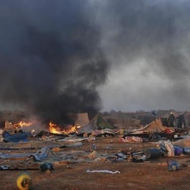Tents burn after Moroccan security forces broke up the protest camp on the outskirts of Western Sahara's capital, El-Ayoun, on November 8, 2010.