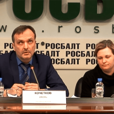 Russian LGBT Network Director Igor Kochetkov (left) and Novaya Gazeta journalist Yelena Milashina (right) at a press conference at the Rosbalt press center in Moscow, Russia on April 3, 2018.