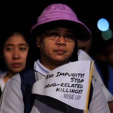 A Catholic nun displays a placard as she participates in a procession against plans to reimpose death penalty and intensify drug war during "Walk for Life" in Luneta park, Metro Manila, Philippines February 24, 2018. REUTERS/Romeo Ranoco