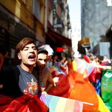 LGBT rights activists hold a rainbow flag during a transgender pride parade which was banned by the governor’s office, in central Istanbul, Turkey, June 19, 2016
