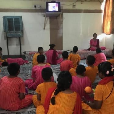 Girls watch television inside the girls’ wing at Asha Kiran, a government-run residential institution for people with intellectual disabilities and mental health needs in Delhi, in April 2018.