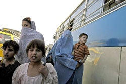 Women and children in Kabul, October 4, 2004. Continuing religious and cultural conservatism and a dangerous security environment mean that women still struggle to participate in the country's evolving political institutions (Photo: Zalmai).