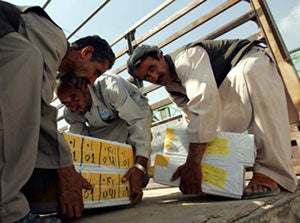 Afghan workers loading ballot papers onto a truck in Kabul September 16, 2005.  (c) Reuters/Ahmad Massod 2005