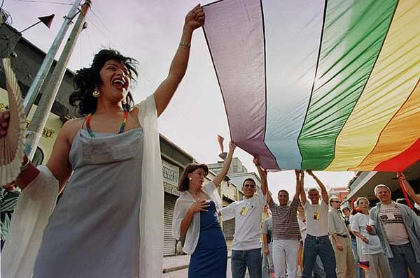 5.Carrying the rainbow flag in the first-ever Pride March in Guatemala, June 25 © 2001 Reuters Limited.

