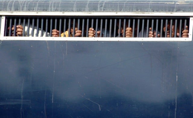 A police bus carrying detained lawyers leaves the city courts in 

Karachi on November 5, 2007. 
© 2007 Reuters

