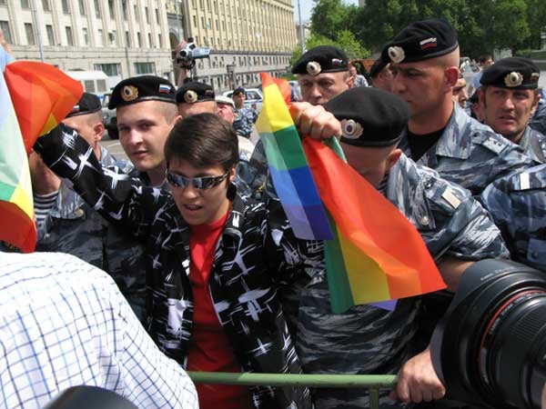 6.Police prepare to arrest an LGBT rights supporter holding rainbow flags  2007 Scott Long/Human Rights Watch

