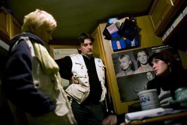 Heroin users and sex workers talk to counselors at a mobile harm reduction center that provides medical and social assistance in St. Petersburg. &copy; 2007 Lorena Ros

