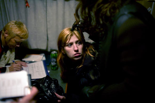 Heroin users and sex workers talk to counselors at a mobile harm reduction center that provides medical and social assistance in St. Petersburg. &copy; 2007 Lorena Ros

