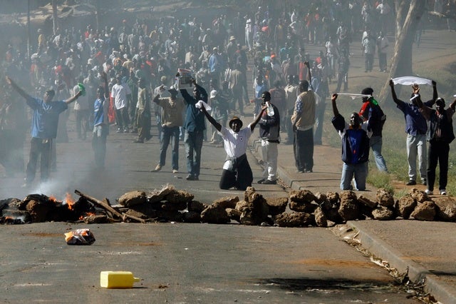 Another opposition rally called for January 3, 2008 was banned by the government. Police dispersed protesters using tear gas, water cannon and sticks.  Further smaller protests continued over the next few days in the slums of Nairobi as well as in Kisumu.  Police continued to use live ammunition to disperse protesters.  Human Rights Watch interviewed an unarmed bystander, age 22, who was shot in the leg when he happened to come across a standoff between police and protesters in Mathare slum. &copy; 2008 Reuters

