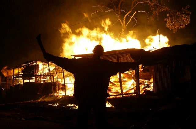 In a surprise move, the head of the Electoral Commission of Kenya, Samuel Kivuitu, announced that Mwai Kibaki had won the presidential race.  Close to midnight on December 30, Kibaki was hurriedly sworn in as president.  As the news spread, burning and looting continued throughout the night across the country. &copy; 2007 Reuters
