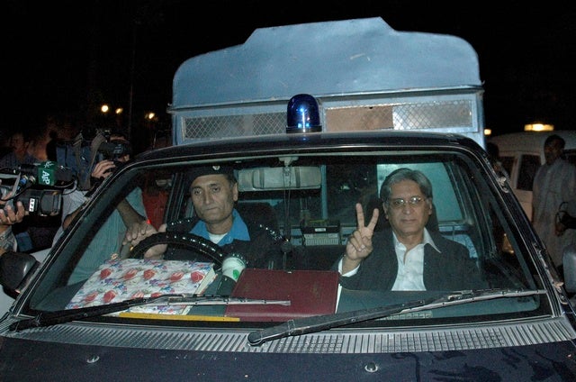 Aitzaz Ahsan (R), president of the Supreme Court Bar Association 

after he was arrested by the police in Islamabad on November 3, 2007. 
© 2007 Reuters

