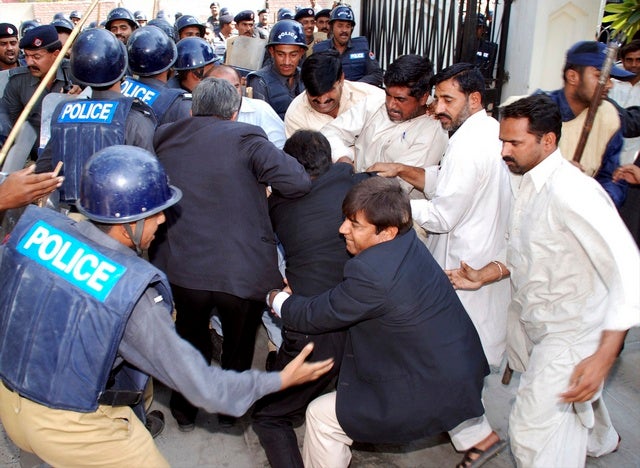 Police arrest lawyers during a raid on a district bar association 

office in Multan on November 6, 2007. 
© 2007 Reuters

