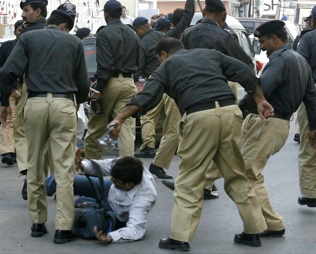 Police beat a photographer who was covering a protest against 

emergency rule in Karachi on November 5, 2007. 
© 2007 Reuters

