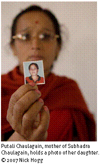 Text Box: 
Putali Chaulagain, mother of Subhadra Chaulagain, holds a photo of her daughter. © 2007 Nick Hogg
