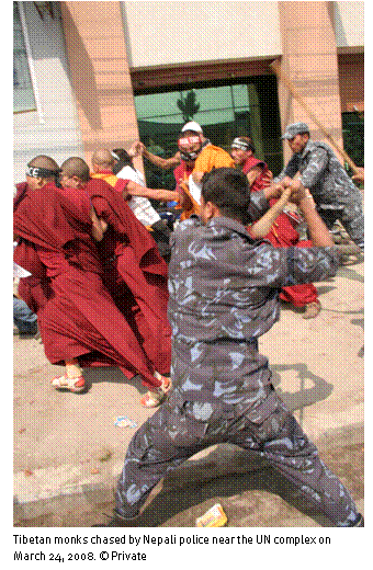 Text Box:  
Tibetan monks chased by Nepali police near the UN complex on March 24, 2008.  Private 
