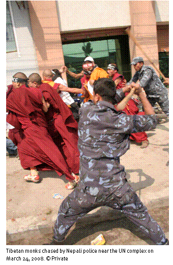 Text Box: 
Tibetan monks chased by Nepali police near the UN complex on March 24, 2008. © Private 
