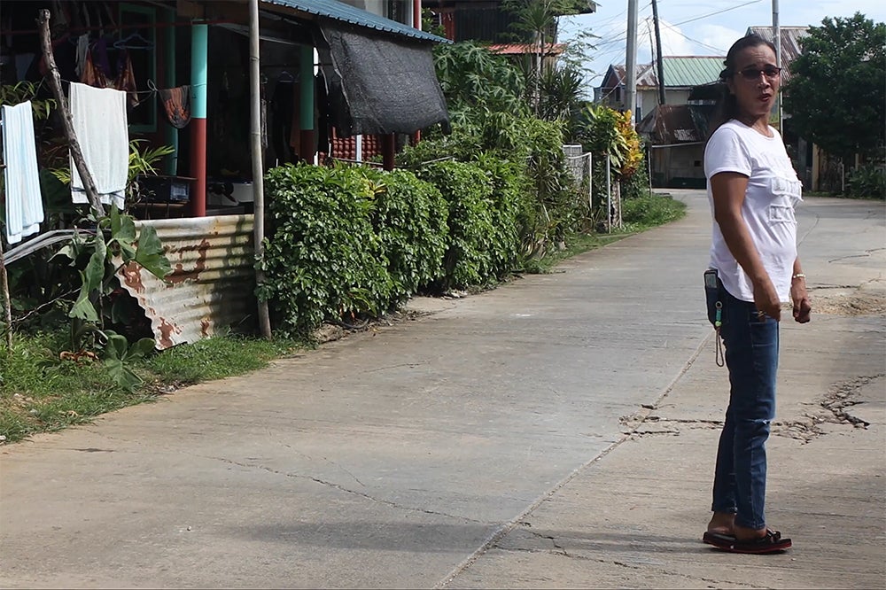 Mirasol walking to work  in Del Carmen, Siargao, Philippines, 2025. © 2025 Camille Robiou du Pont/Human Rights Watch 