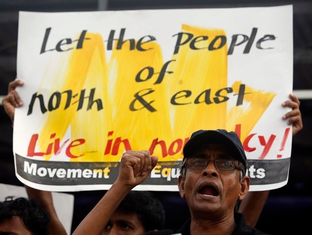 <p>A member of an equal rights movement shouts slogans during a protest against the government in Colombo on December 18, 2012.</p>