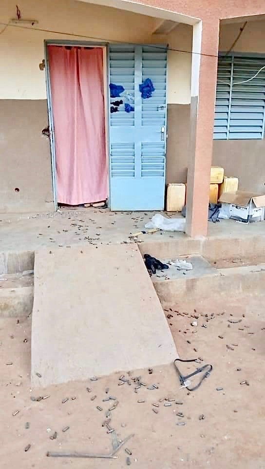 Bullet casings in front of a pink doorway